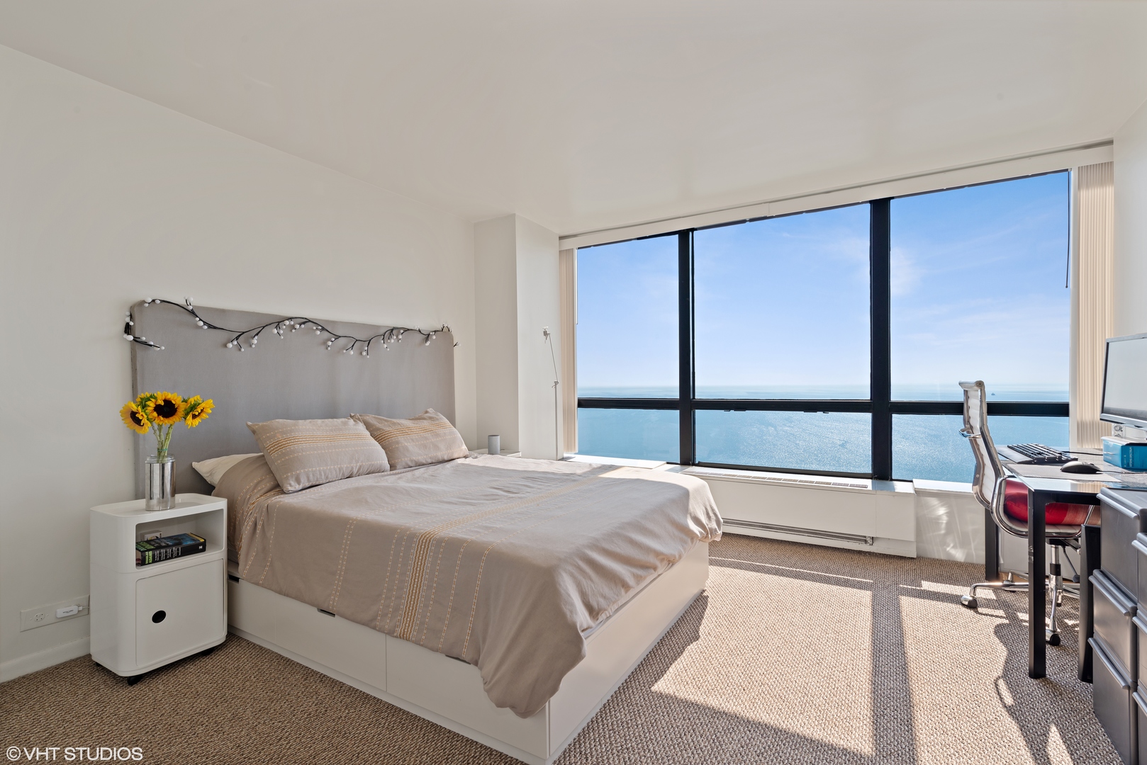 5415 North Sheridan Road, Unit 5305 Chicago, IL 60640 - Photo 8 of 16 a bedroom with a bed and a table