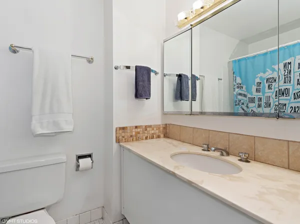 a bathroom with a sink and mirror
