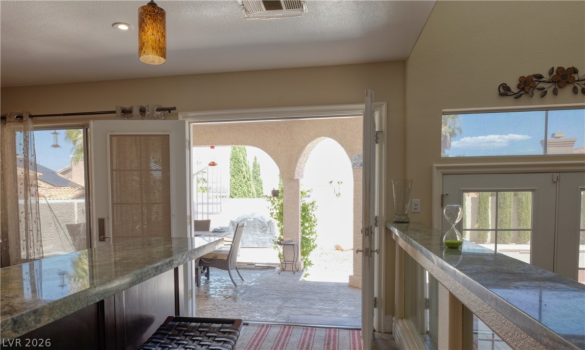 3704 North Campbell Road Las Vegas, NV 89129 - Photo 16 of 38 Step through French doors to a private patio, perfect for outdoor enjoyment.