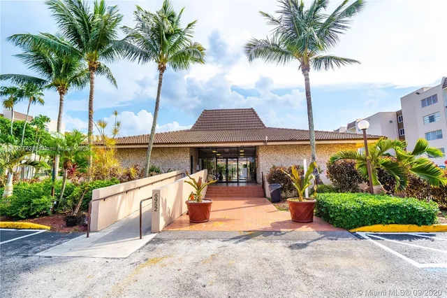 a front view of house with yard and swimming pool
