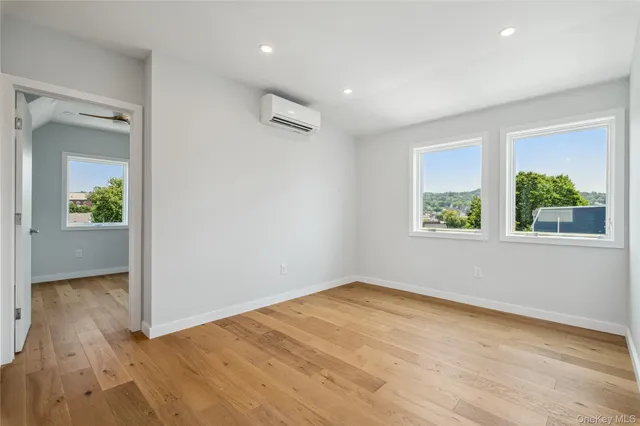 a bathroom with a double vanity sink and mirror