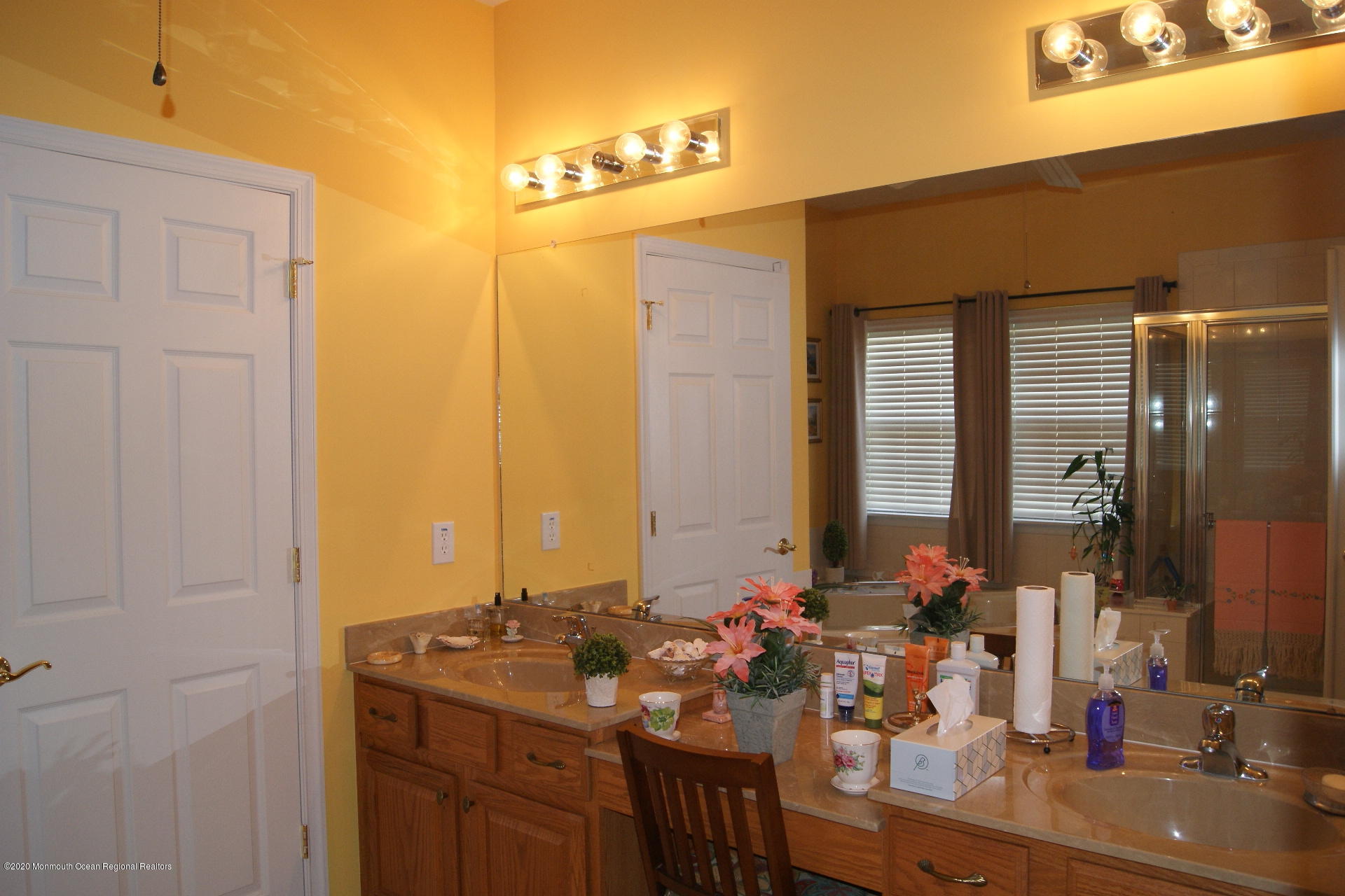 9 Bellagio Road Manchester Township, NJ 08759 - Photo 14 of 37 a bathroom with a double vanity sink and a mirror