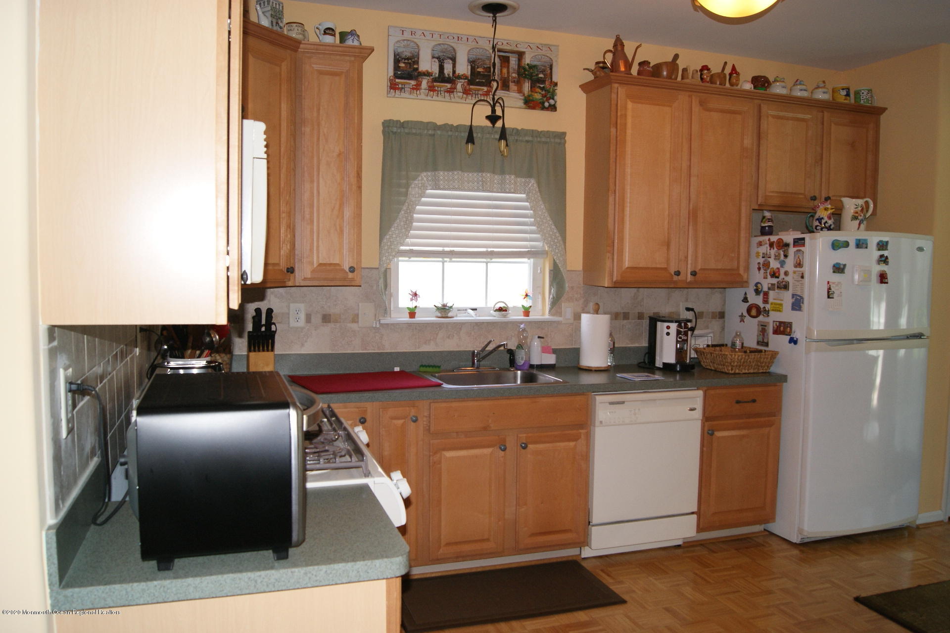 9 Bellagio Road Manchester Township, NJ 08759 - Photo 24 of 37 a kitchen with stainless steel appliances granite countertop a refrigerator a sink dishwasher a stove with white countertops and cabinets