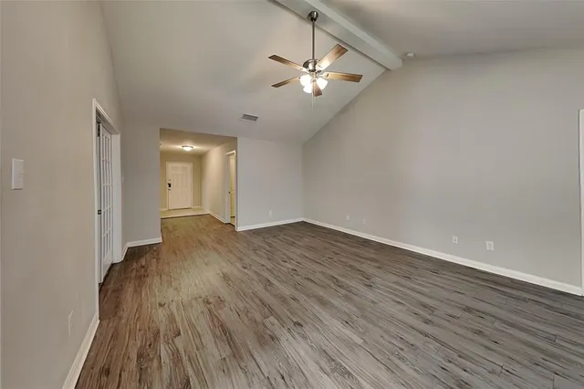 a view of a livingroom with wooden floor