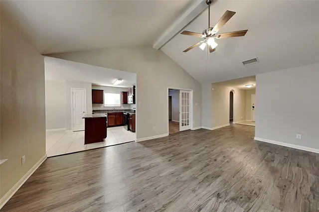 a view of a kitchen with a sink cabinets and wooden floor