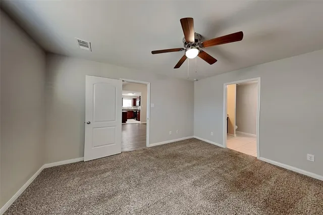 a view of an empty room and window