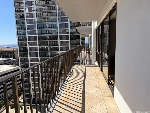 a view of balcony with wooden floor and windows
