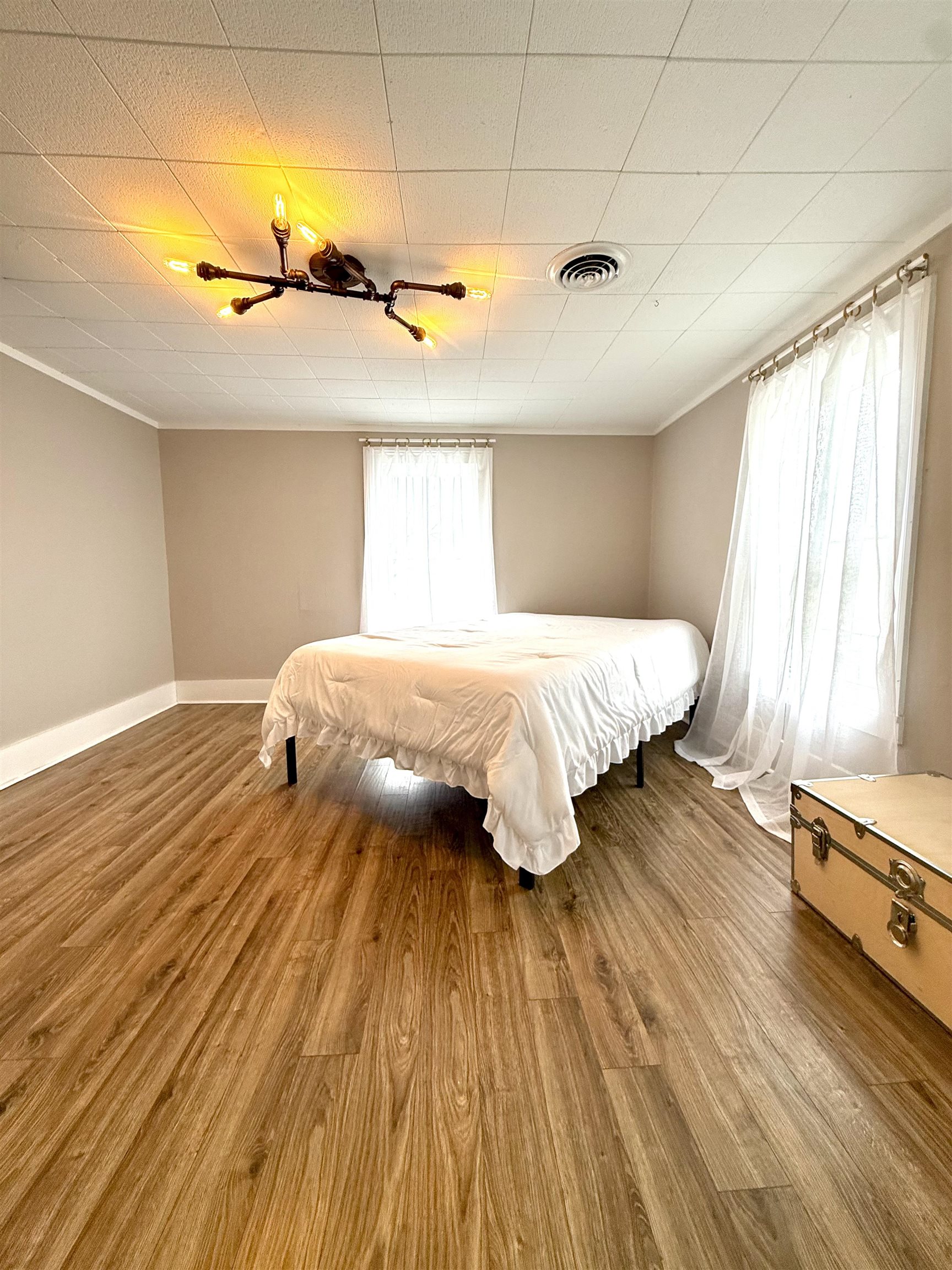 15385 Evergreen Valley Road Timberville, VA 22853 - Photo 29 of 44 a bedroom with a bed and wooden floor