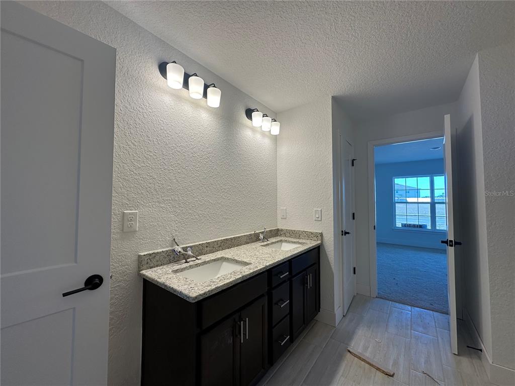 4546 Southwest 90th Ln Road Ocala, FL 34476 - Photo 8 of 9 a bathroom with a sink and a mirror