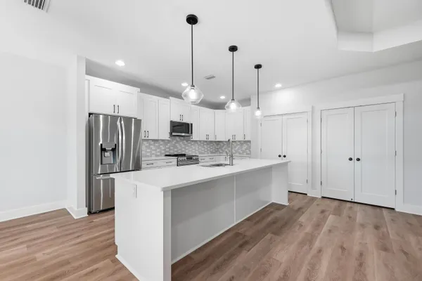 a bathroom with a sink and shower