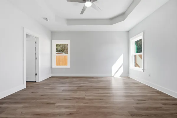 a view of a hallway with brick walls