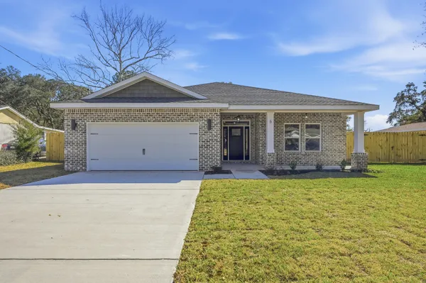 a view of a hallway with wooden floor and a window