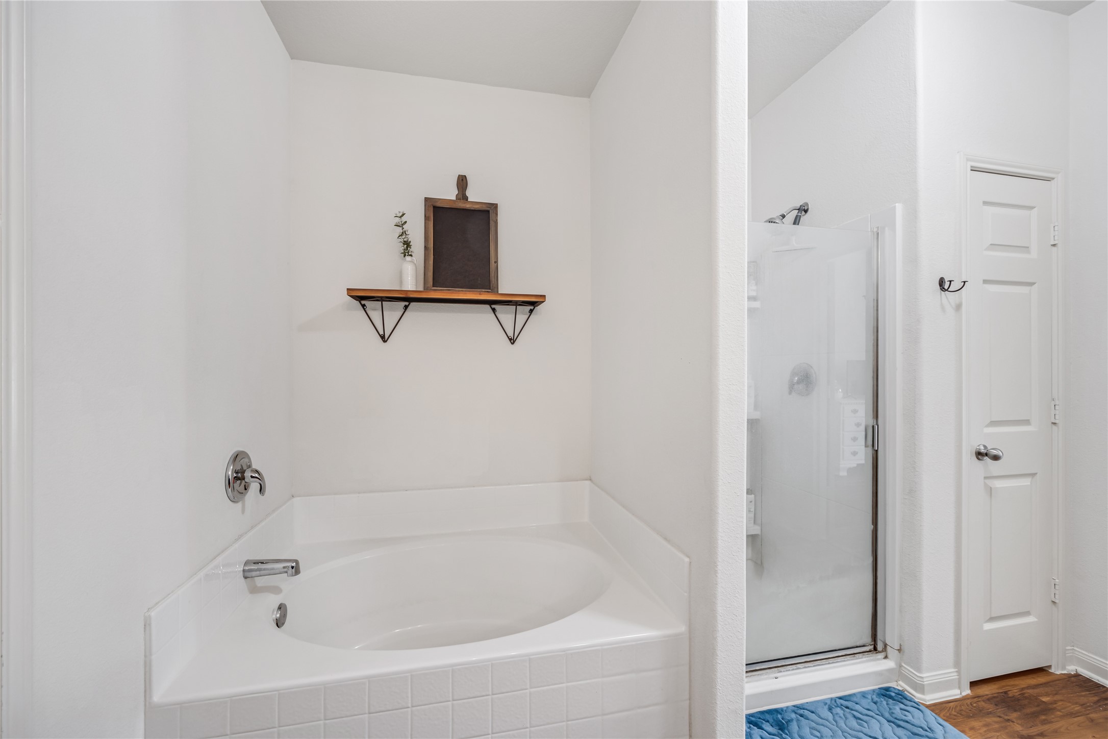 319 Falling Pine Drive Conroe, TX 77304 - Photo 13 of 22 a white bath tub sitting next to a shower