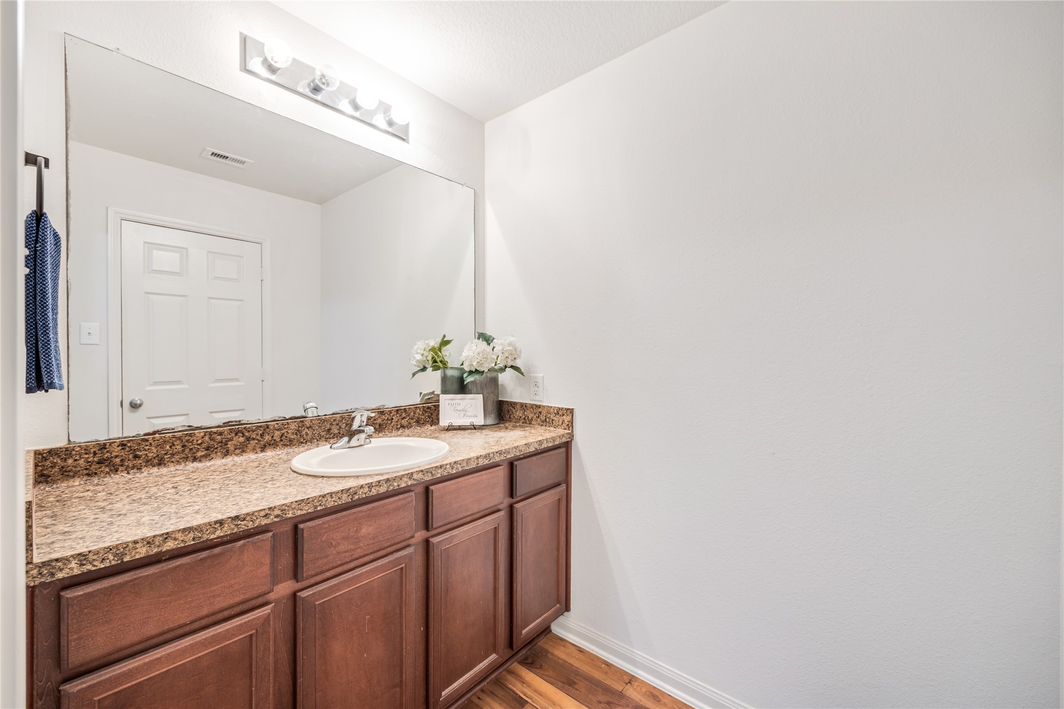 319 Falling Pine Drive Conroe, TX 77304 - Photo 15 of 22 a bathroom with a granite countertop sink and a mirror