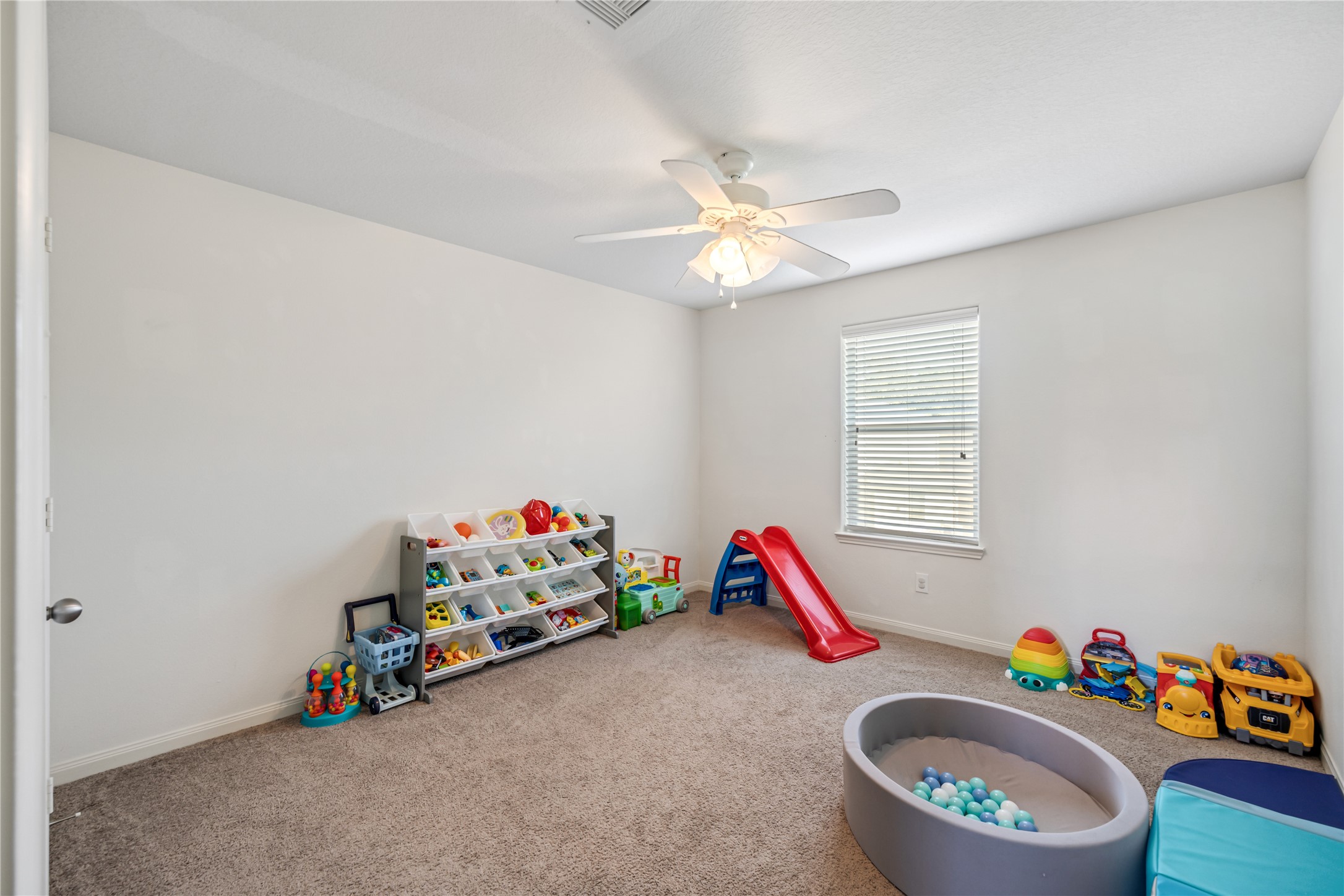319 Falling Pine Drive Conroe, TX 77304 - Photo 18 of 22 a view of play room with toys