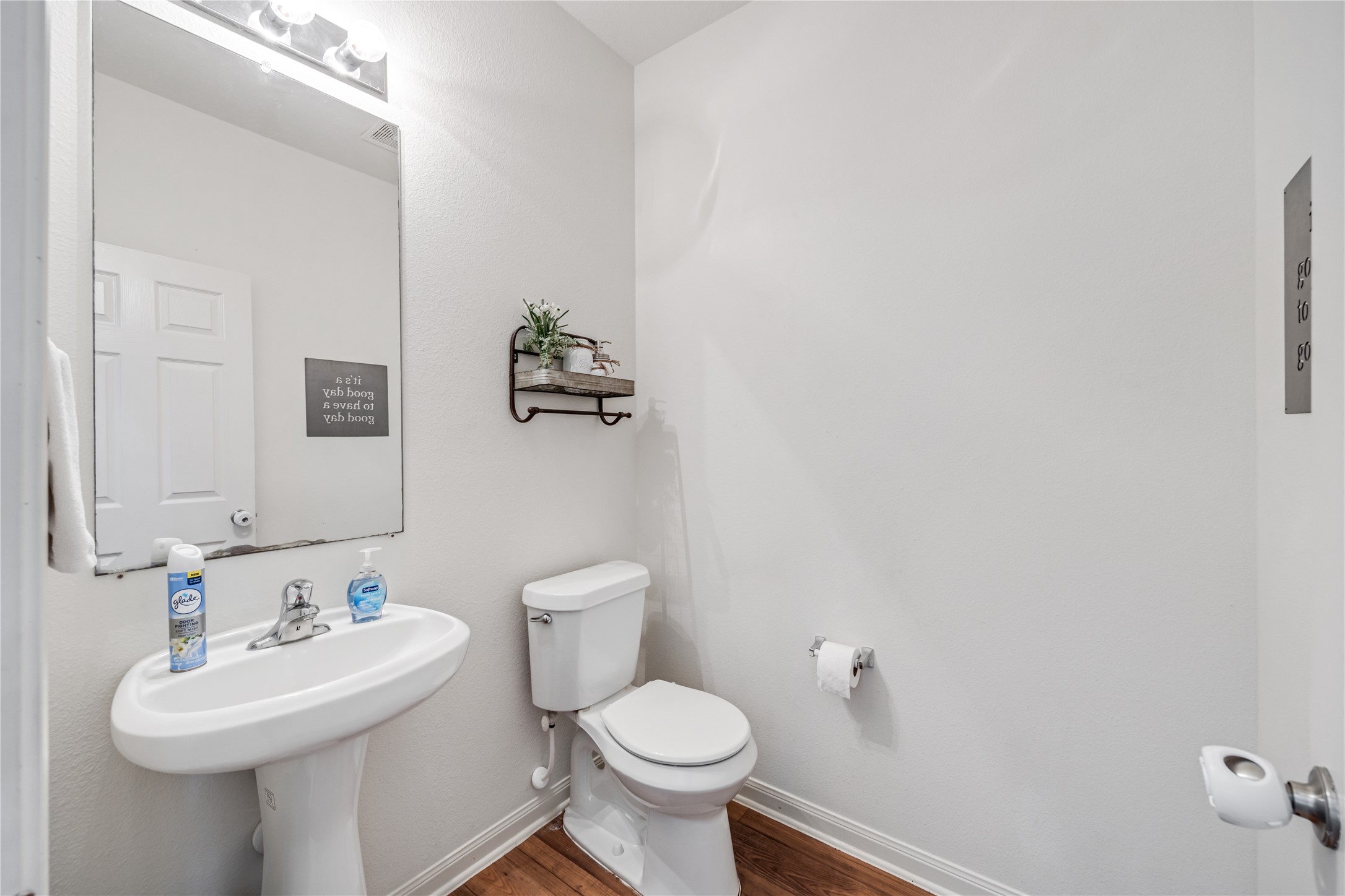 319 Falling Pine Drive Conroe, TX 77304 - Photo 10 of 22 a bathroom with a toilet sink and mirror