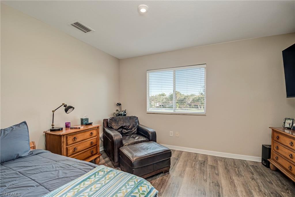 1897 Par Drive Naples, FL 34120 - Photo 22 of 31 a bedroom with furniture and a window
