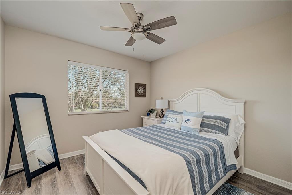 1897 Par Drive Naples, FL 34120 - Photo 23 of 31 a bedroom with a bed and a window
