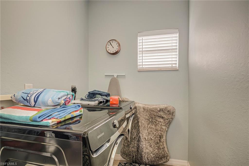 1897 Par Drive Naples, FL 34120 - Photo 26 of 31 a utility room with dryer and washer