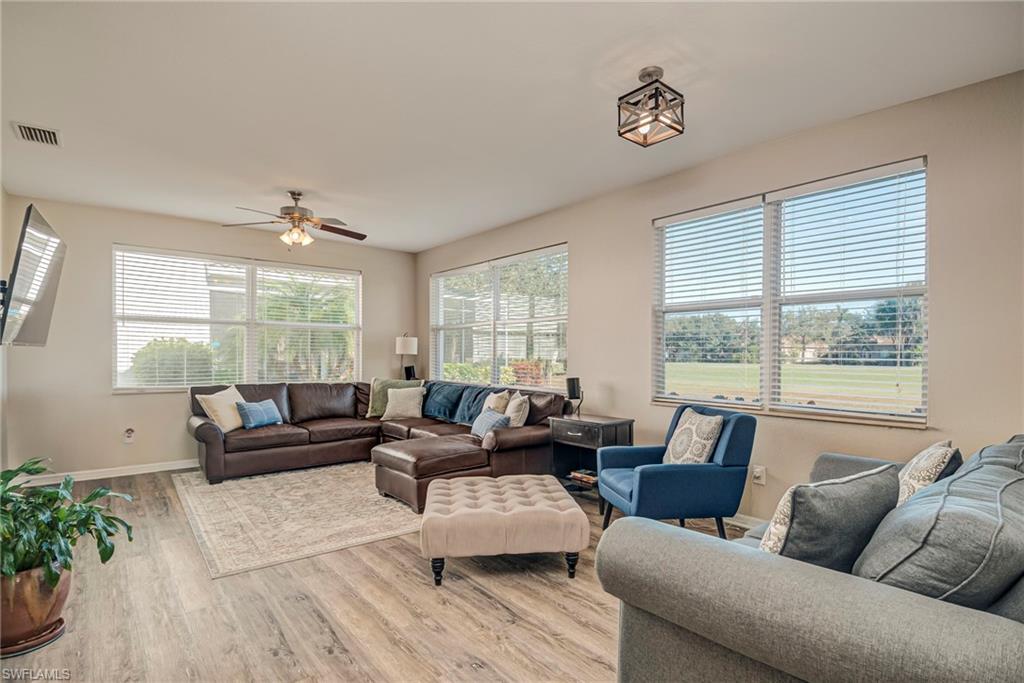 1897 Par Drive Naples, FL 34120 - Photo 3 of 31 a living room with furniture and a large window