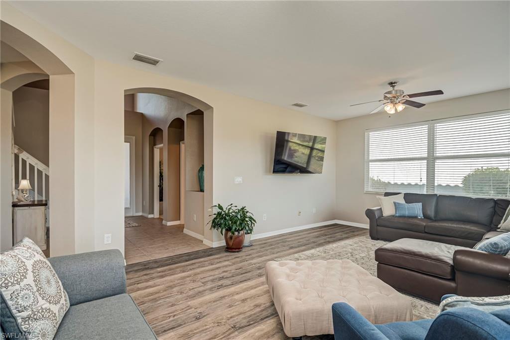 1897 Par Drive Naples, FL 34120 - Photo 4 of 31 a living room with furniture and a large window