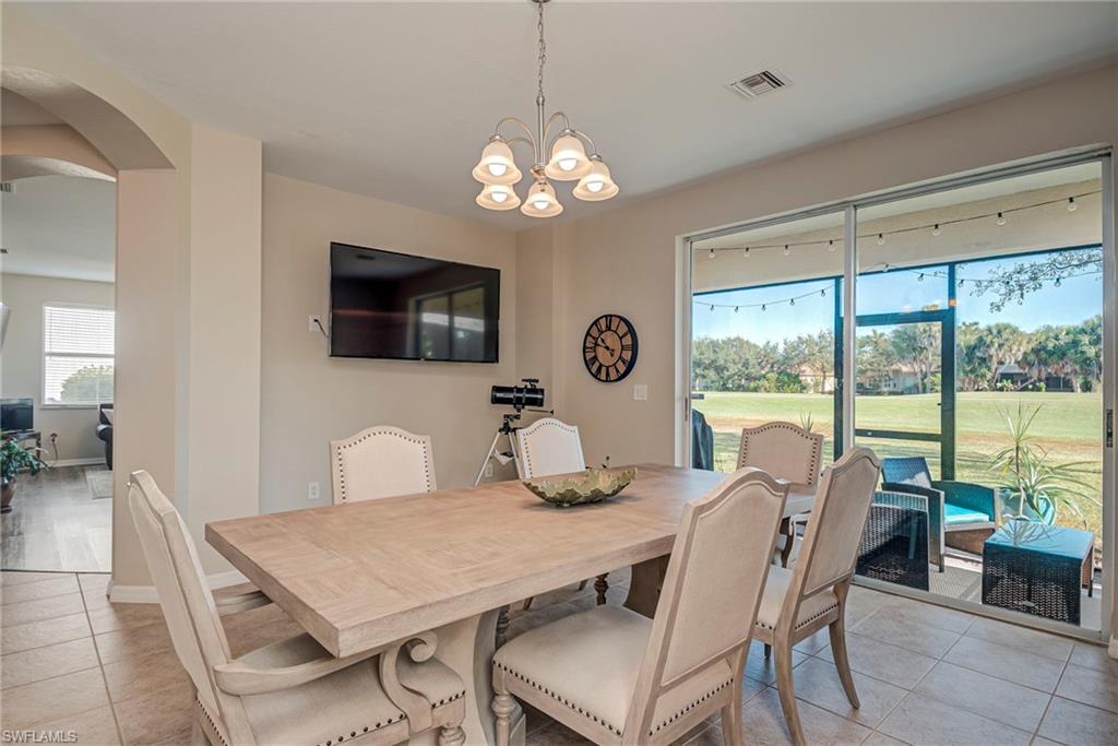 1897 Par Drive Naples, FL 34120 - Photo 7 of 31 a view of a dining room with furniture window and outside view