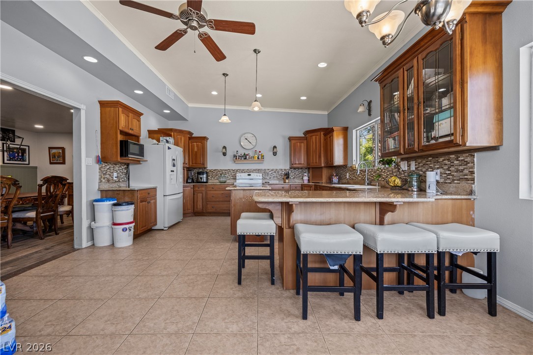 750 Leming Avenue Overton, NV 89040 - Photo 23 of 82 This spacious kitchen offers a seamless blend of comfort and functionality, perfect for everyday living.