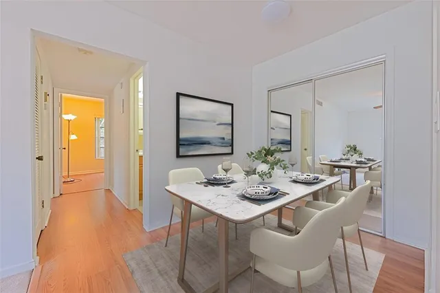 a view of a dining room with furniture and wooden floor