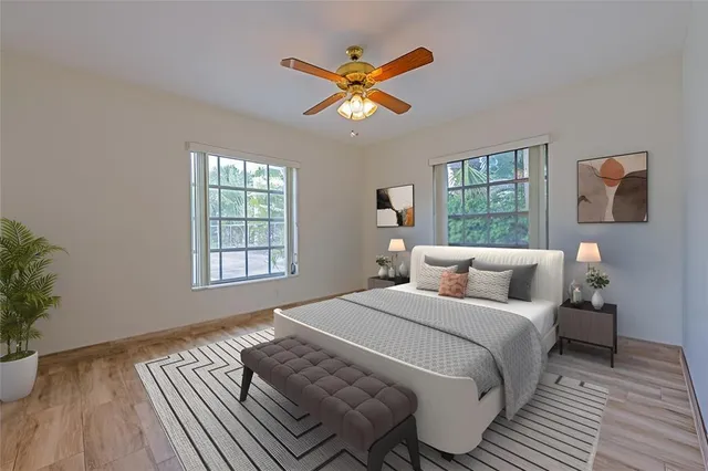 a bedroom with a bed and window