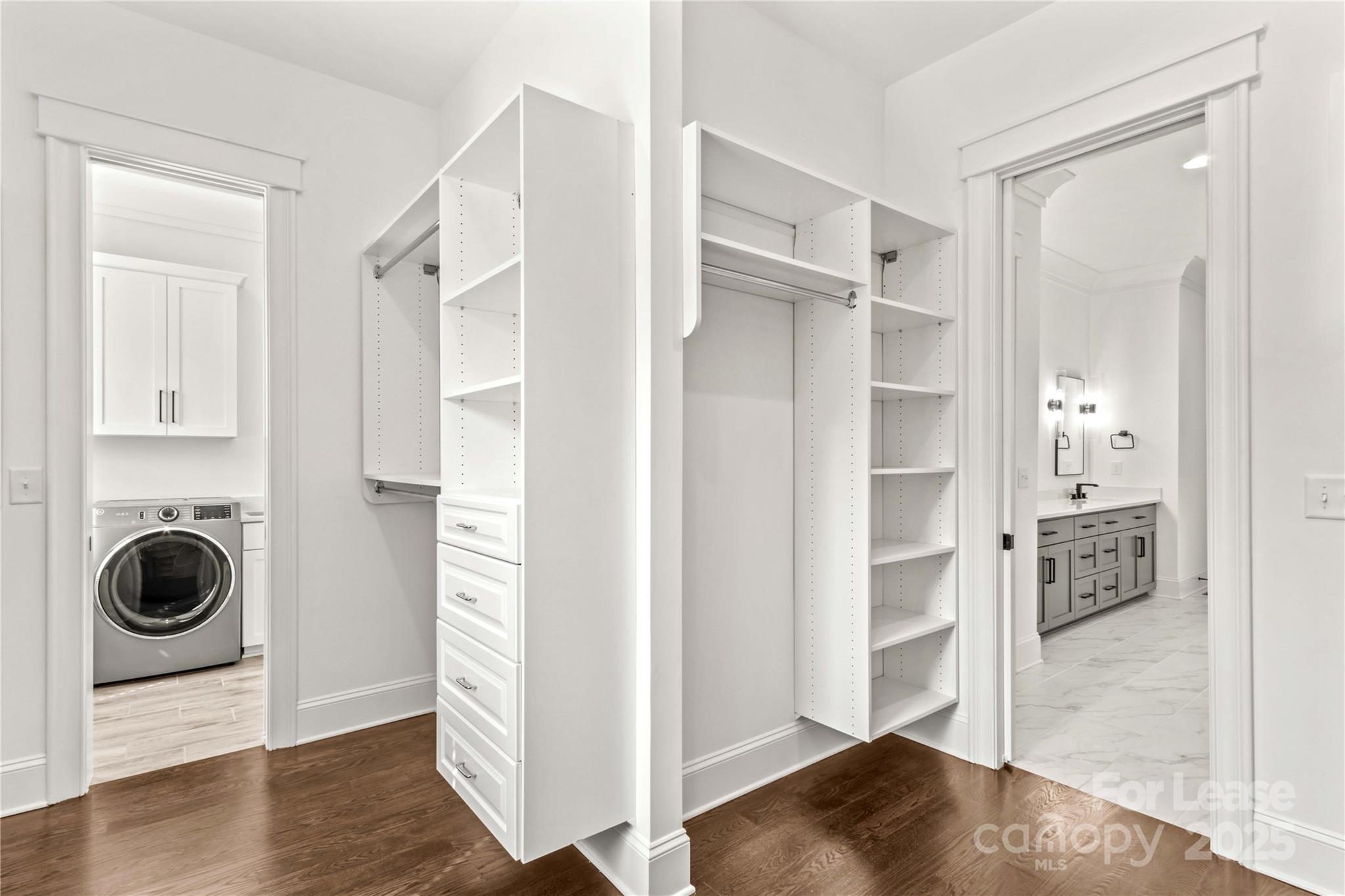 269 Conroy Avenue Davidson, NC 28036 - Photo 13 of 48 a view of a walk in closet and bedroom with wooden floor