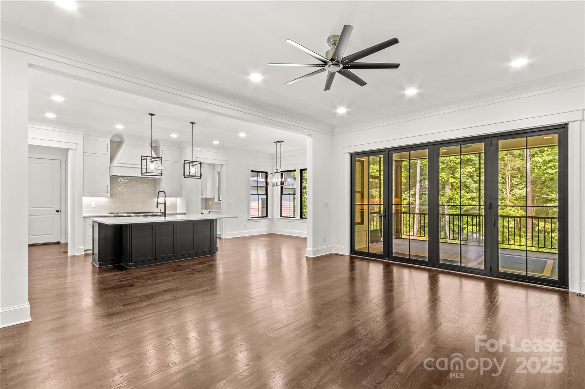 269 Conroy Avenue Davidson, NC 28036 - Photo 15 of 48 a view of an empty room with wooden floor and a window