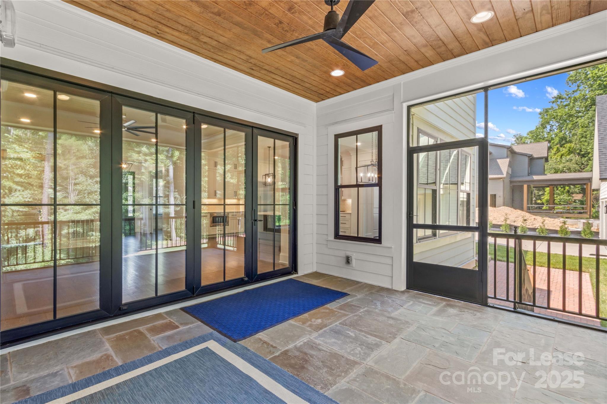 269 Conroy Avenue Davidson, NC 28036 - Photo 16 of 48 a view of an empty room with wooden floor and a window