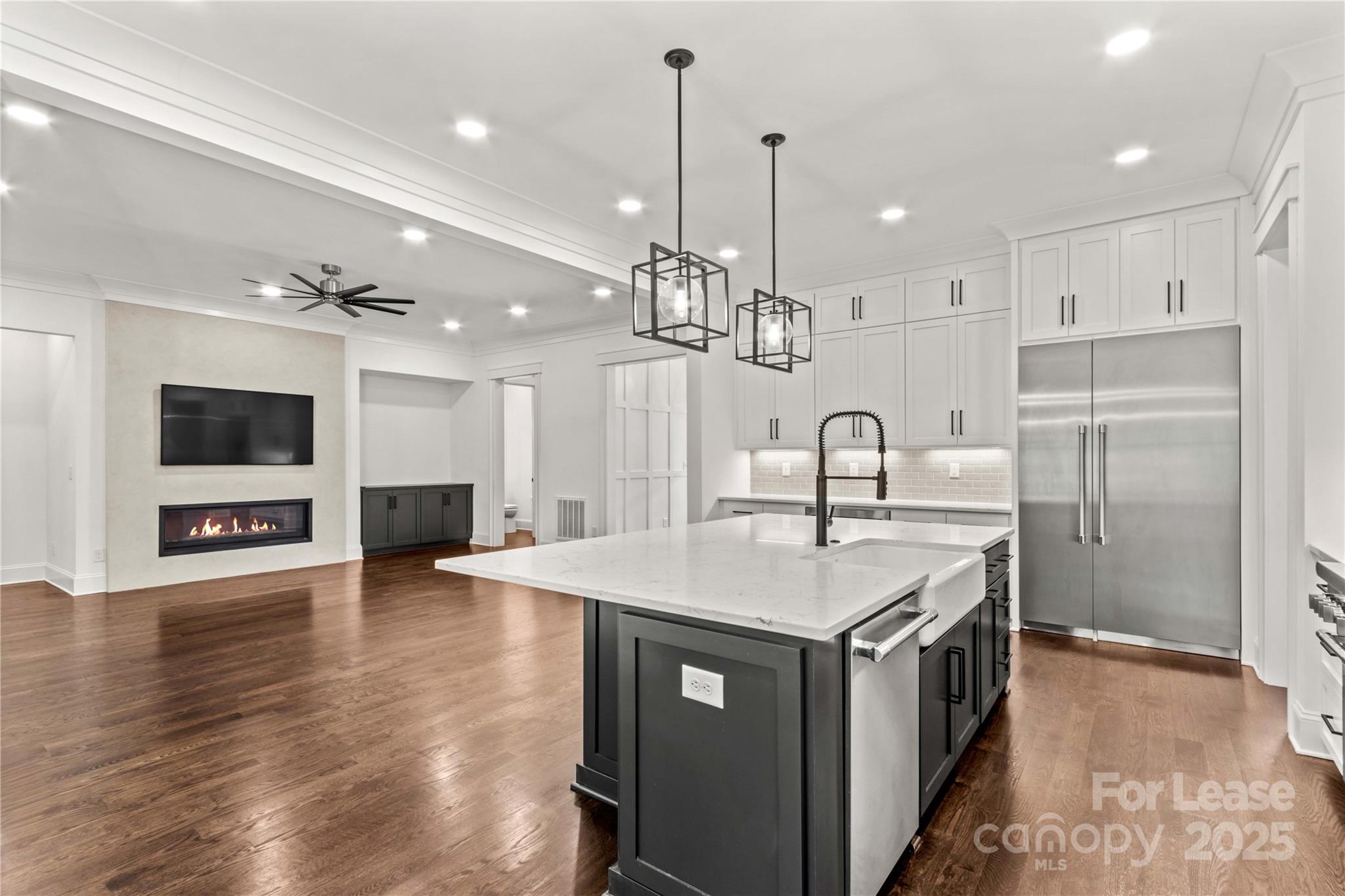 269 Conroy Avenue Davidson, NC 28036 - Photo 19 of 48 a kitchen with stainless steel appliances a sink stove and refrigerator