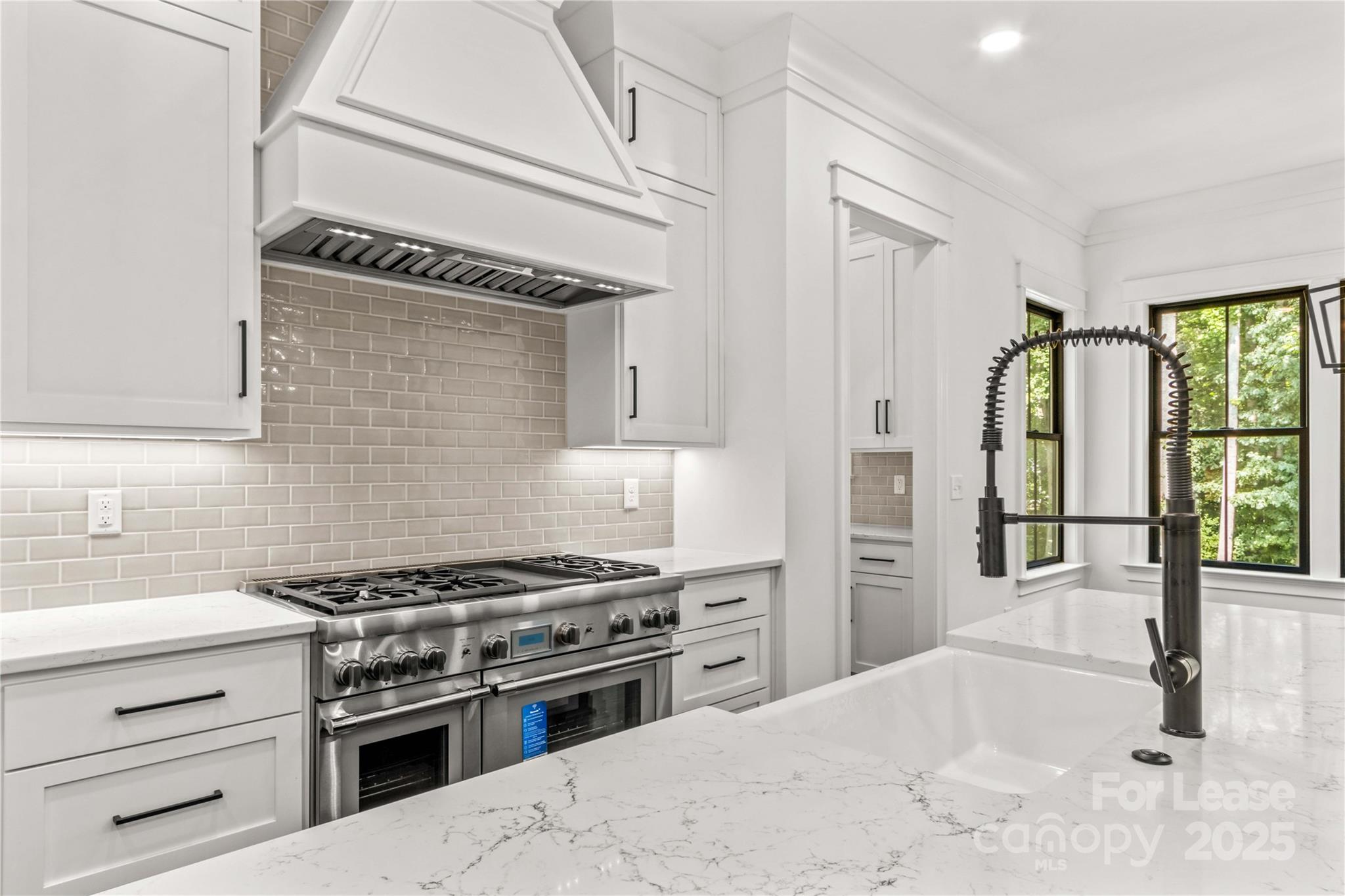 269 Conroy Avenue Davidson, NC 28036 - Photo 22 of 48 a kitchen with a stove and a sink