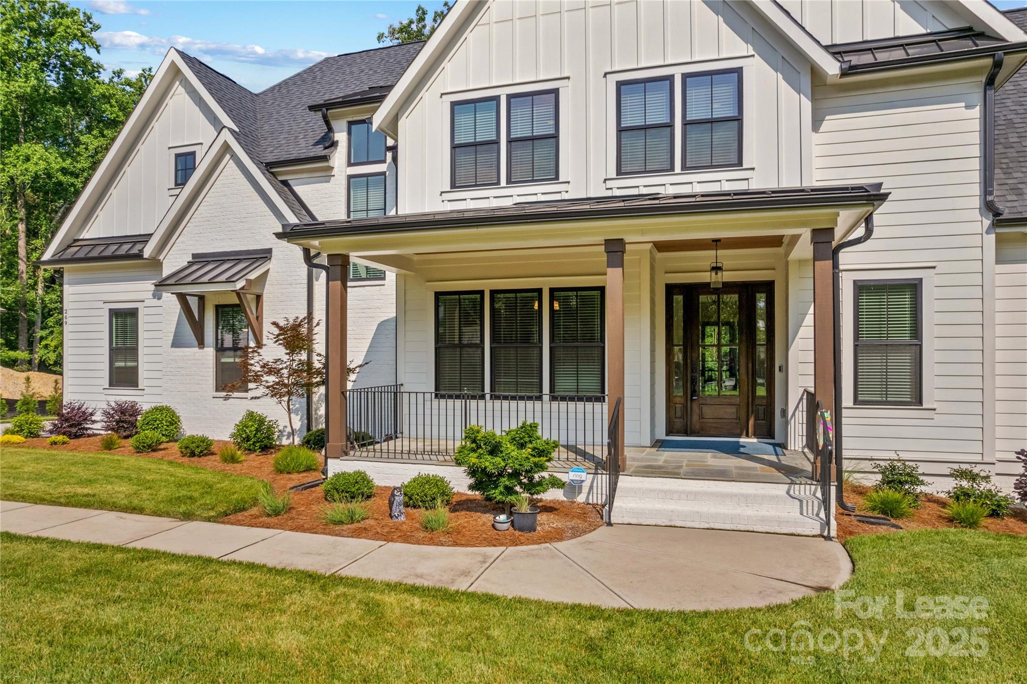 269 Conroy Avenue Davidson, NC 28036 - Photo 3 of 48 front view of a house with a yard
