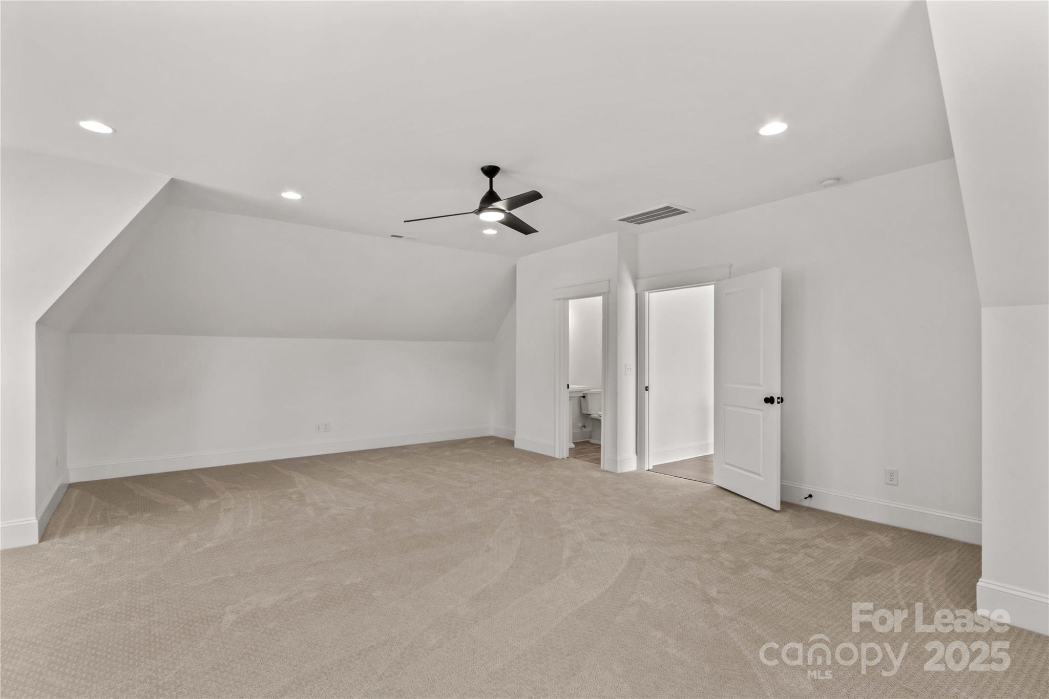 269 Conroy Avenue Davidson, NC 28036 - Photo 37 of 48 an empty room with a ceiling fan and a window