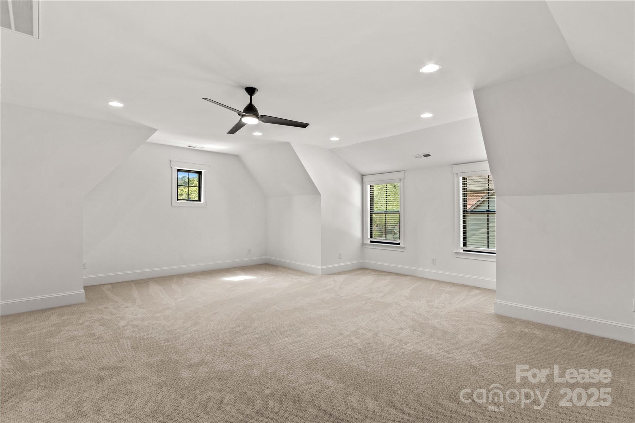 269 Conroy Avenue Davidson, NC 28036 - Photo 38 of 48 an empty room with windows and ceiling fan