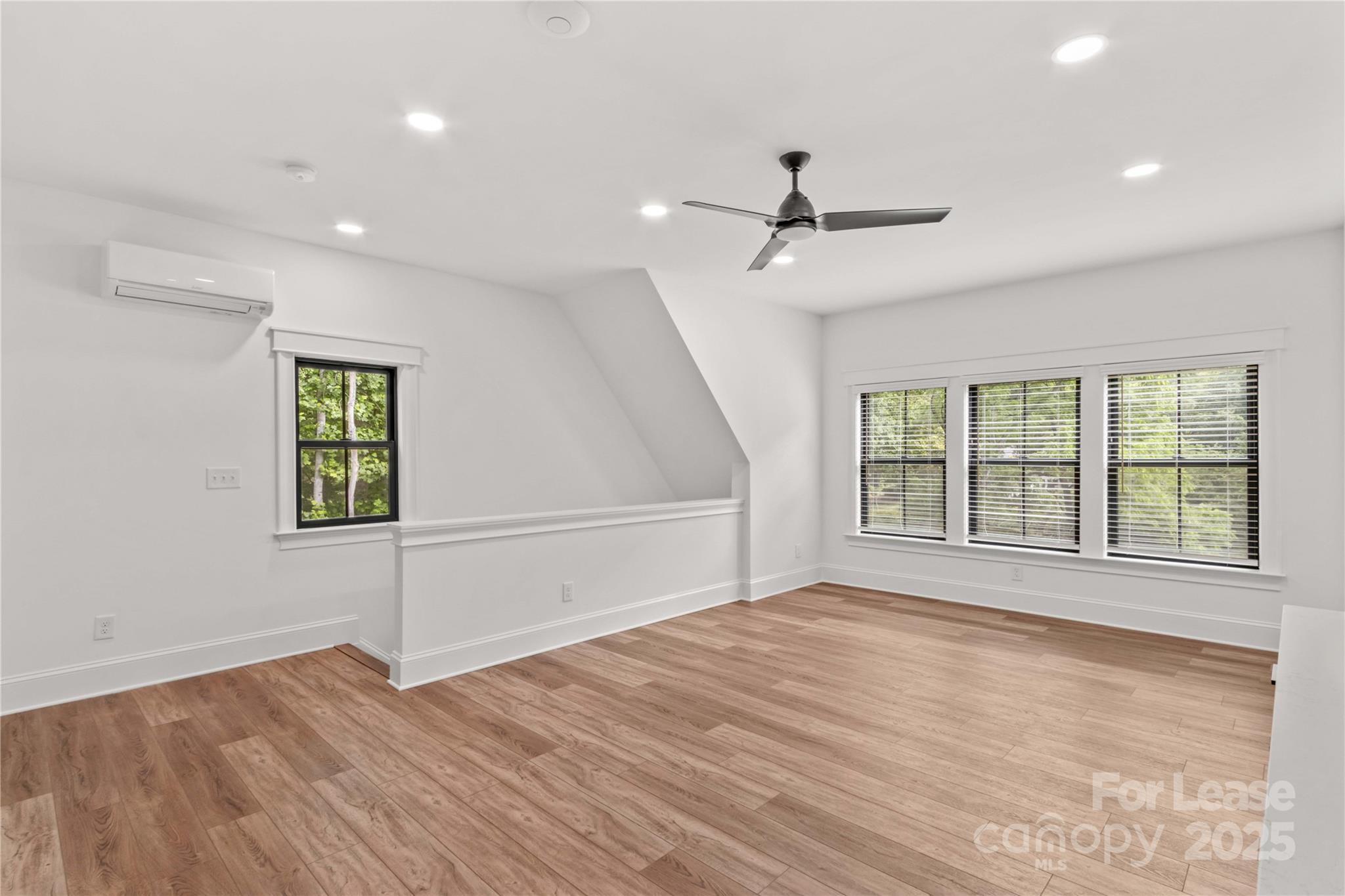 269 Conroy Avenue Davidson, NC 28036 - Photo 40 of 48 a view of an empty room with a window and wooden floor