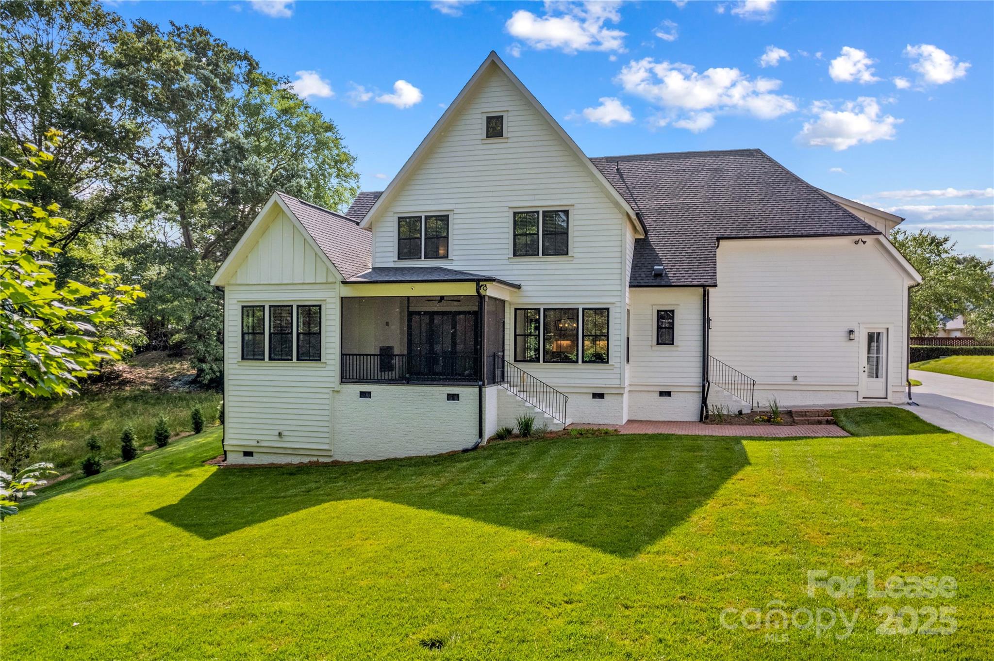 269 Conroy Avenue Davidson, NC 28036 - Photo 43 of 48 a front view of a house with a yard and garage