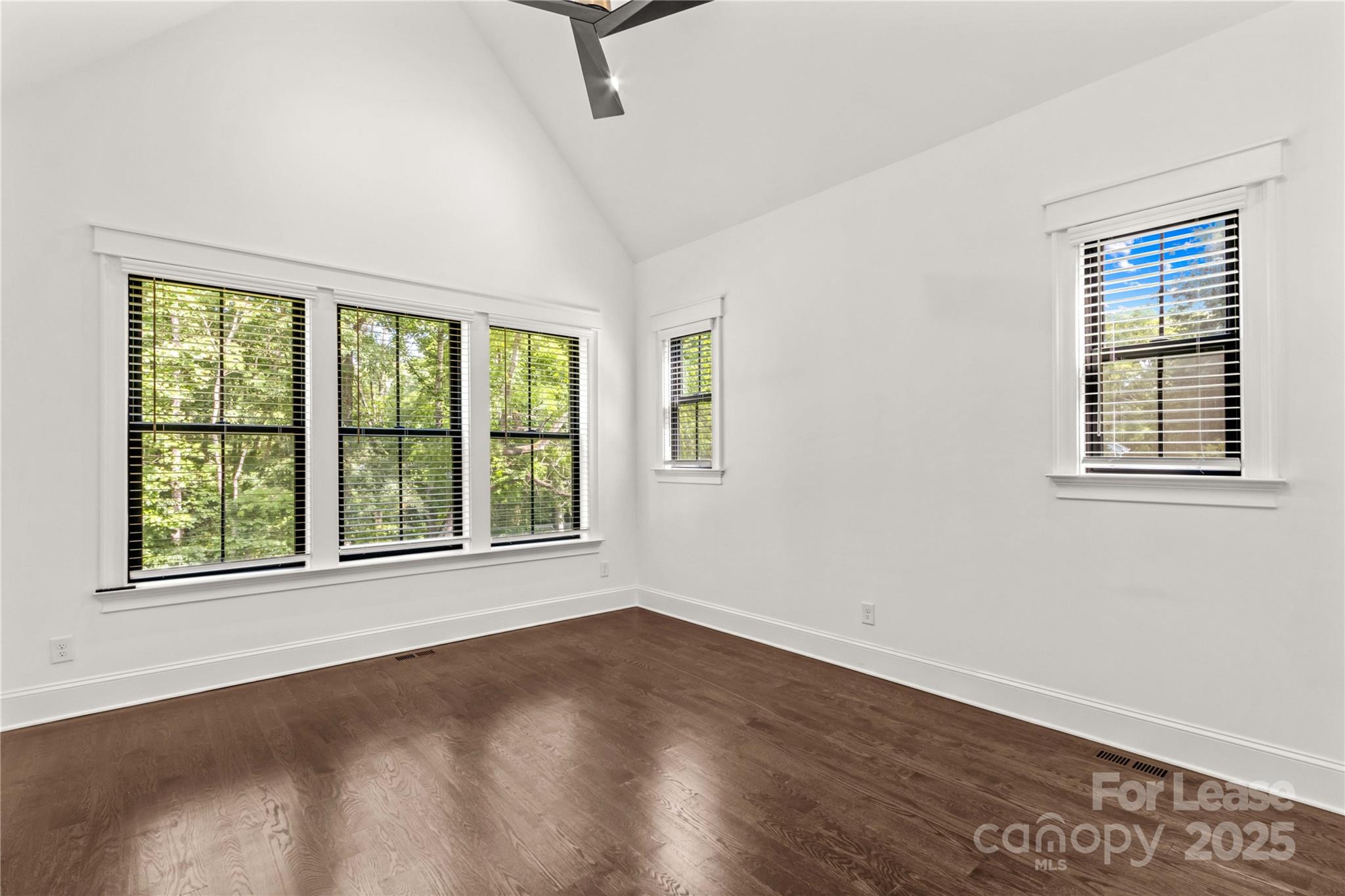 269 Conroy Avenue Davidson, NC 28036 - Photo 10 of 48 an empty room with wooden floor and windows