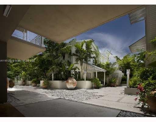 3540 Main Highway, Unit 305 Miami, FL 33133 - Photo 8 of 14 a view of a house with potted plants