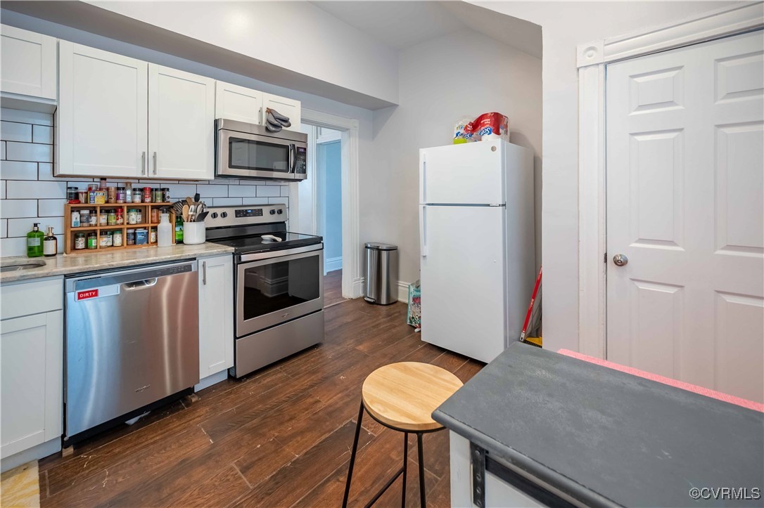 5 West Graham Road Richmond, VA 23222 - Photo 18 of 42 a kitchen with stainless steel appliances a white refrigerator stove and a microwave