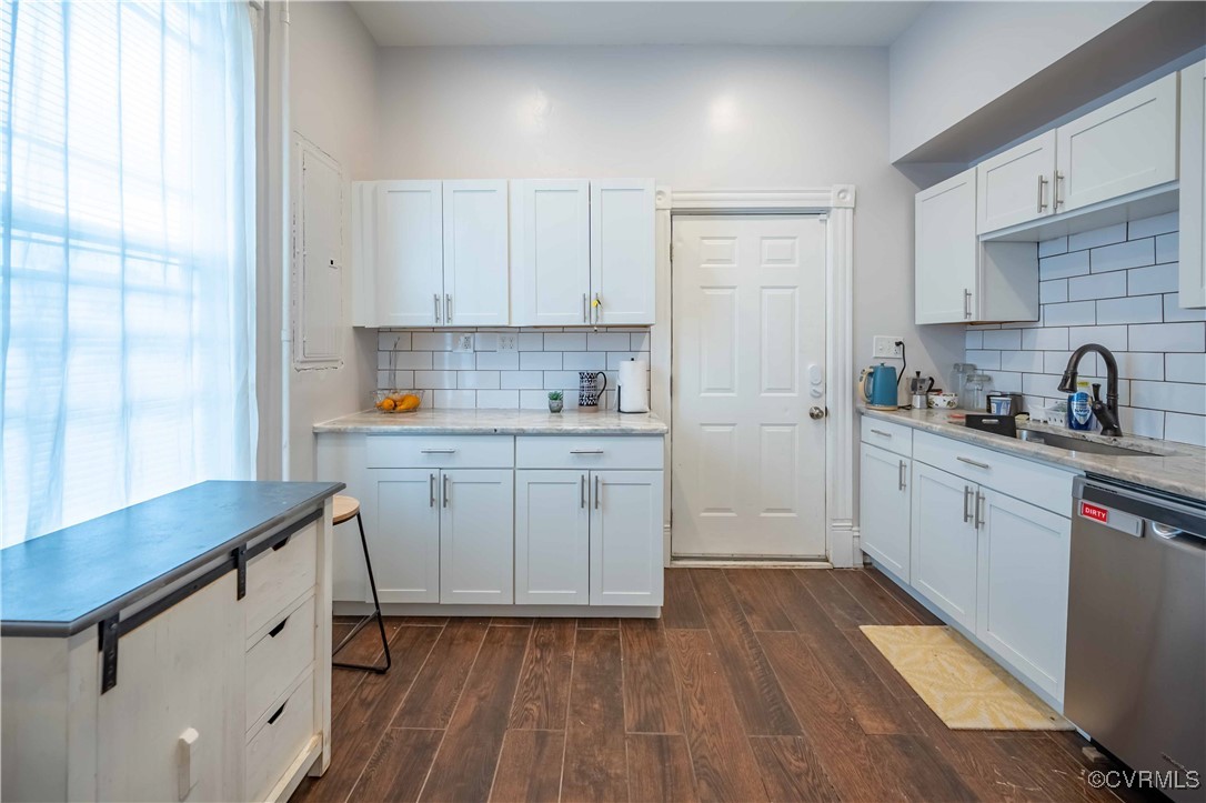 5 West Graham Road Richmond, VA 23222 - Photo 20 of 42 a kitchen with a sink cabinets stainless steel appliances and a window