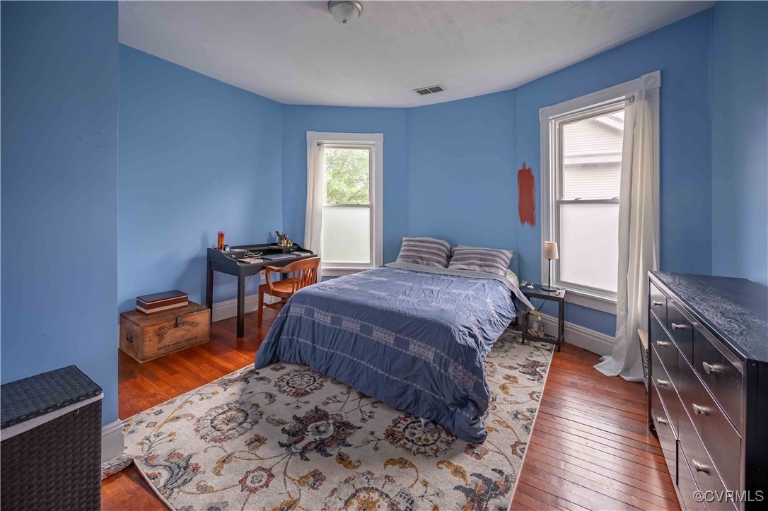 5 West Graham Road Richmond, VA 23222 - Photo 22 of 42 a bedroom with a bed and wooden floor