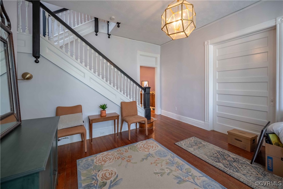 5 West Graham Road Richmond, VA 23222 - Photo 3 of 42 a view of a hallway with wooden floor and stairs