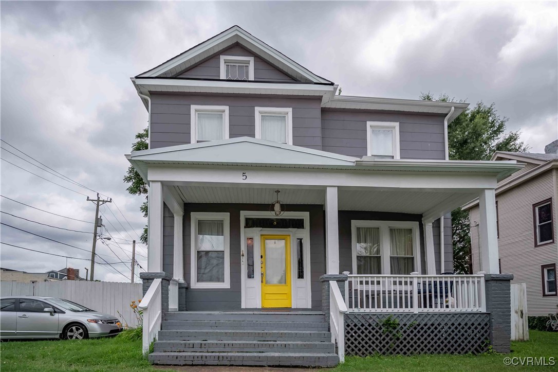 5 West Graham Road Richmond, VA 23222 - Photo 5 of 42 a view of a brick house with large windows and a yard
