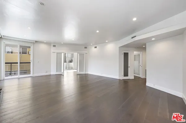wooden floor in a hall with an entryway and a living room