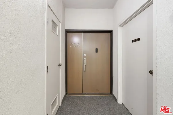a view of a hallway with closet area