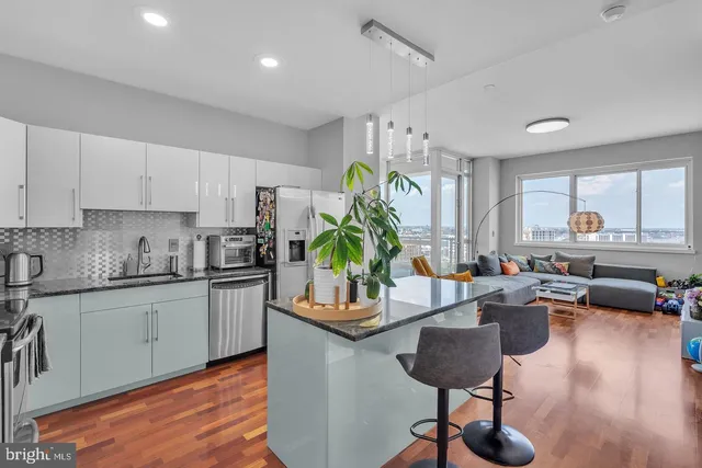 a kitchen with granite countertop lots of counter top space and furniture