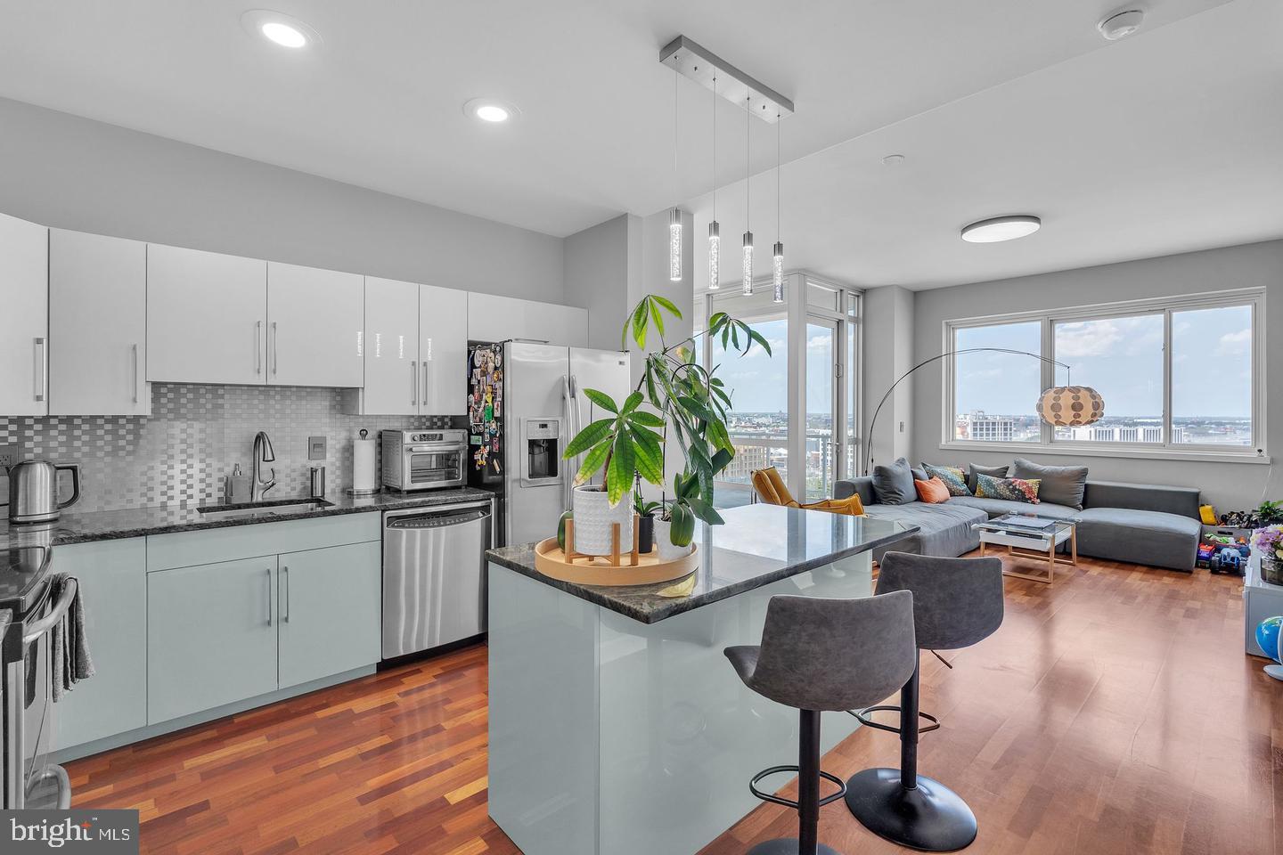 a kitchen with granite countertop lots of counter top space and furniture
